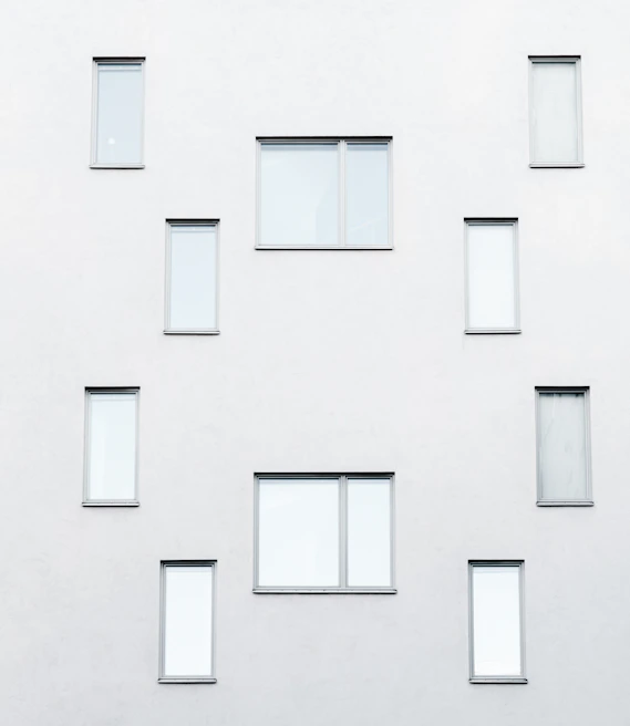 Exterior facade featuring fresh paint and minimalist design in silver tones