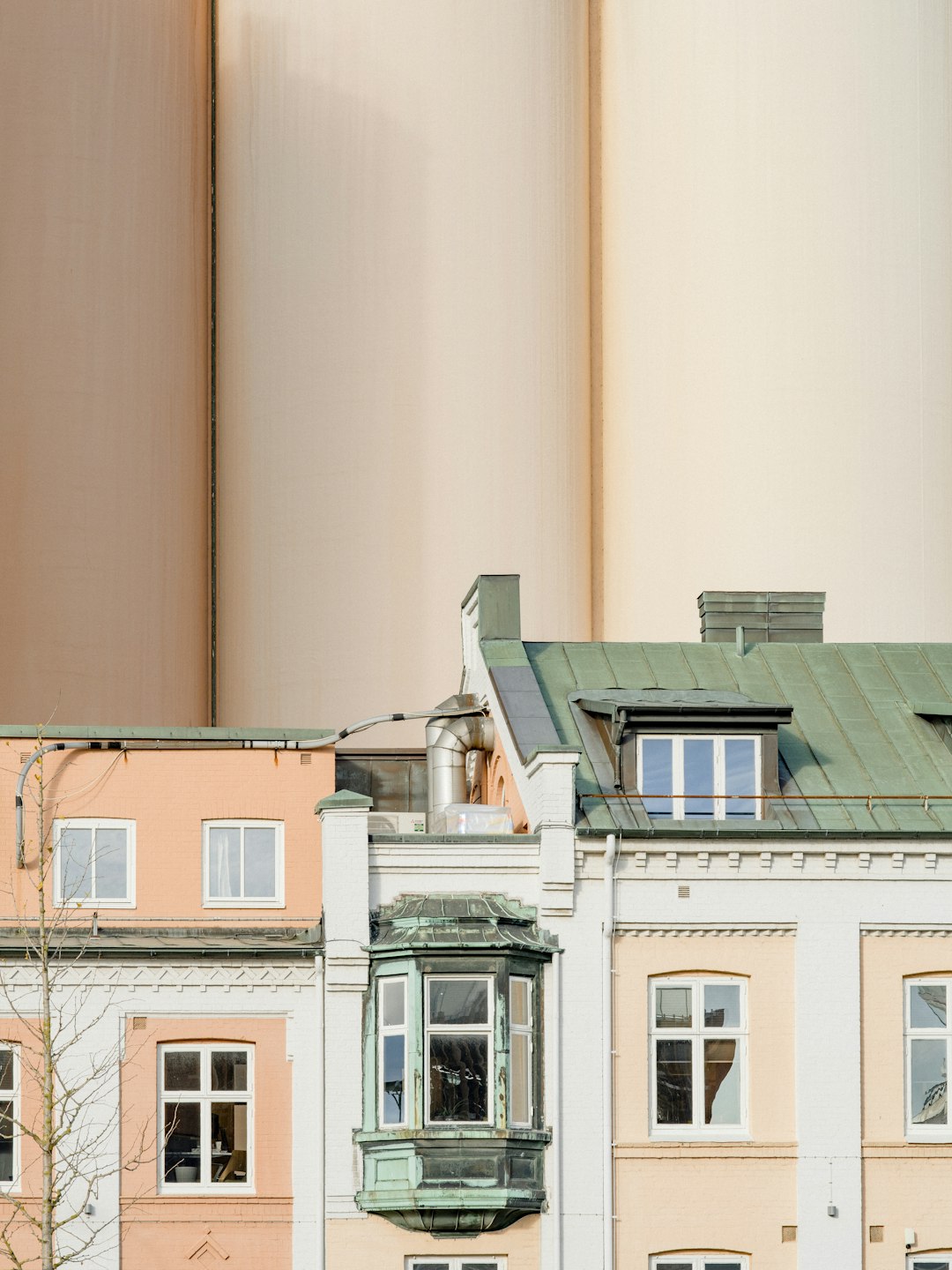 beige and green concrete house near wall