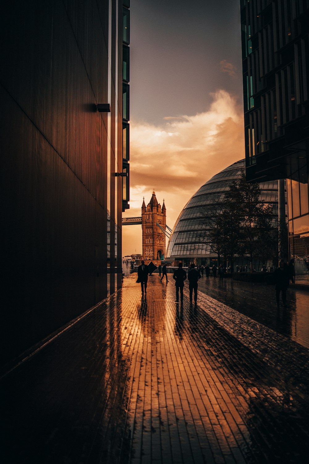 people walking near Tower Bridge during golden hour