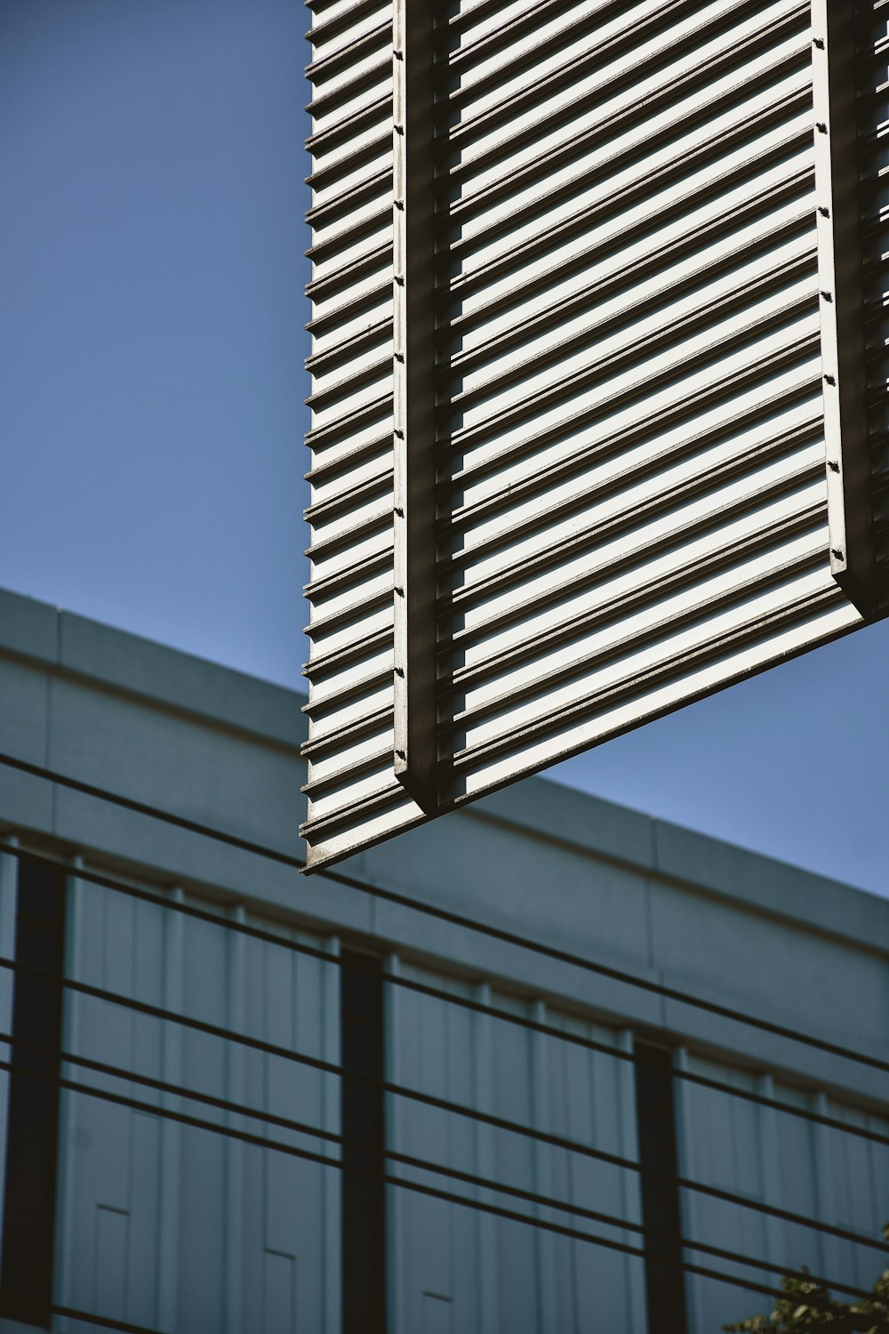 a close up of a street sign with a building in the background