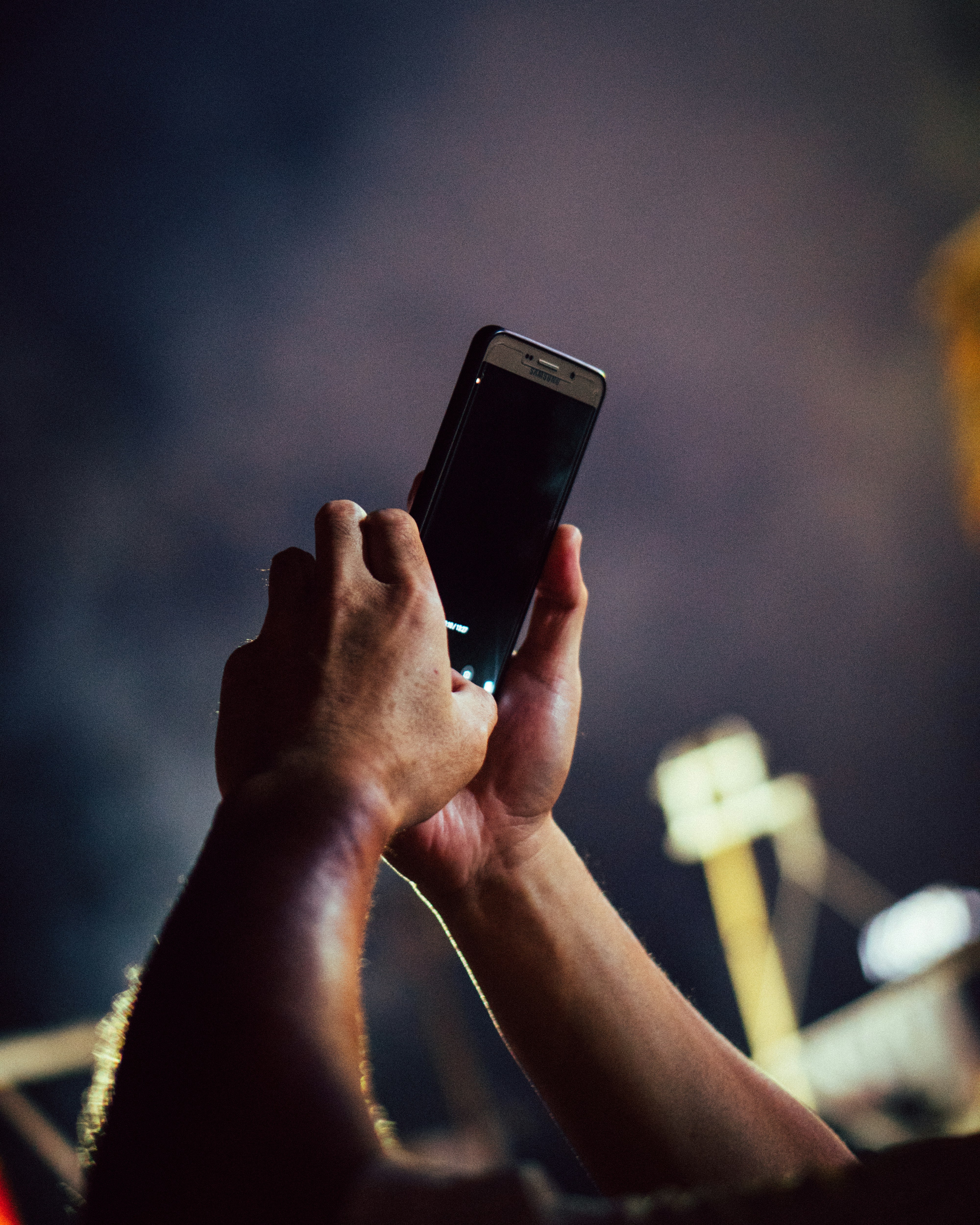 person taking photo on smartphone