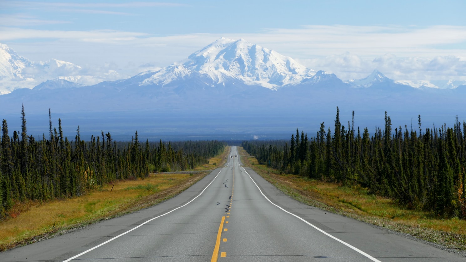 empty road with mountain in distance