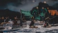 A detailed miniature wargame scene with well-crafted figures in armor holding weapons, set on a snowy terrain. The diorama includes small structures and gothic-style gates, suggesting a medieval or fantasy setting. The background shows green and dark tones that enhance the mysterious atmosphere.