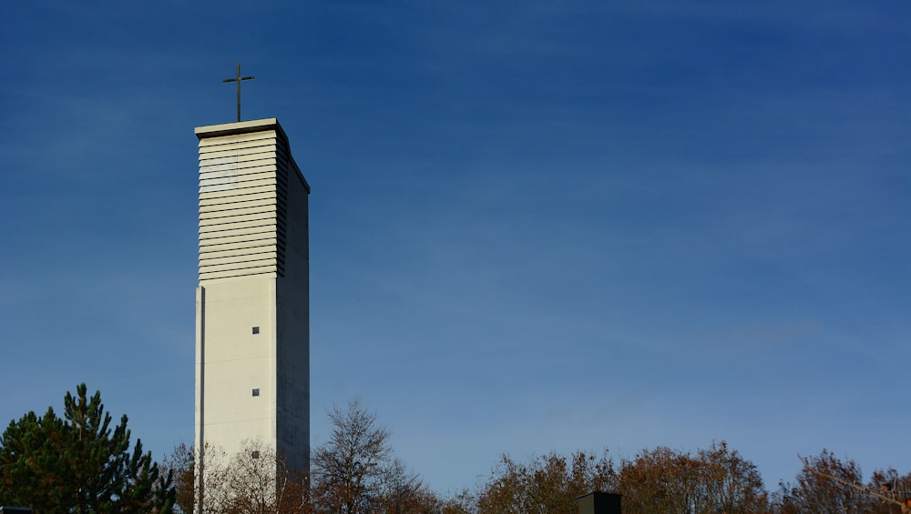 cross on top of gray building