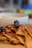 Close-up of a stack of fluffy blueberry pancakes topped with fresh blueberries and a drizzle of syrup.