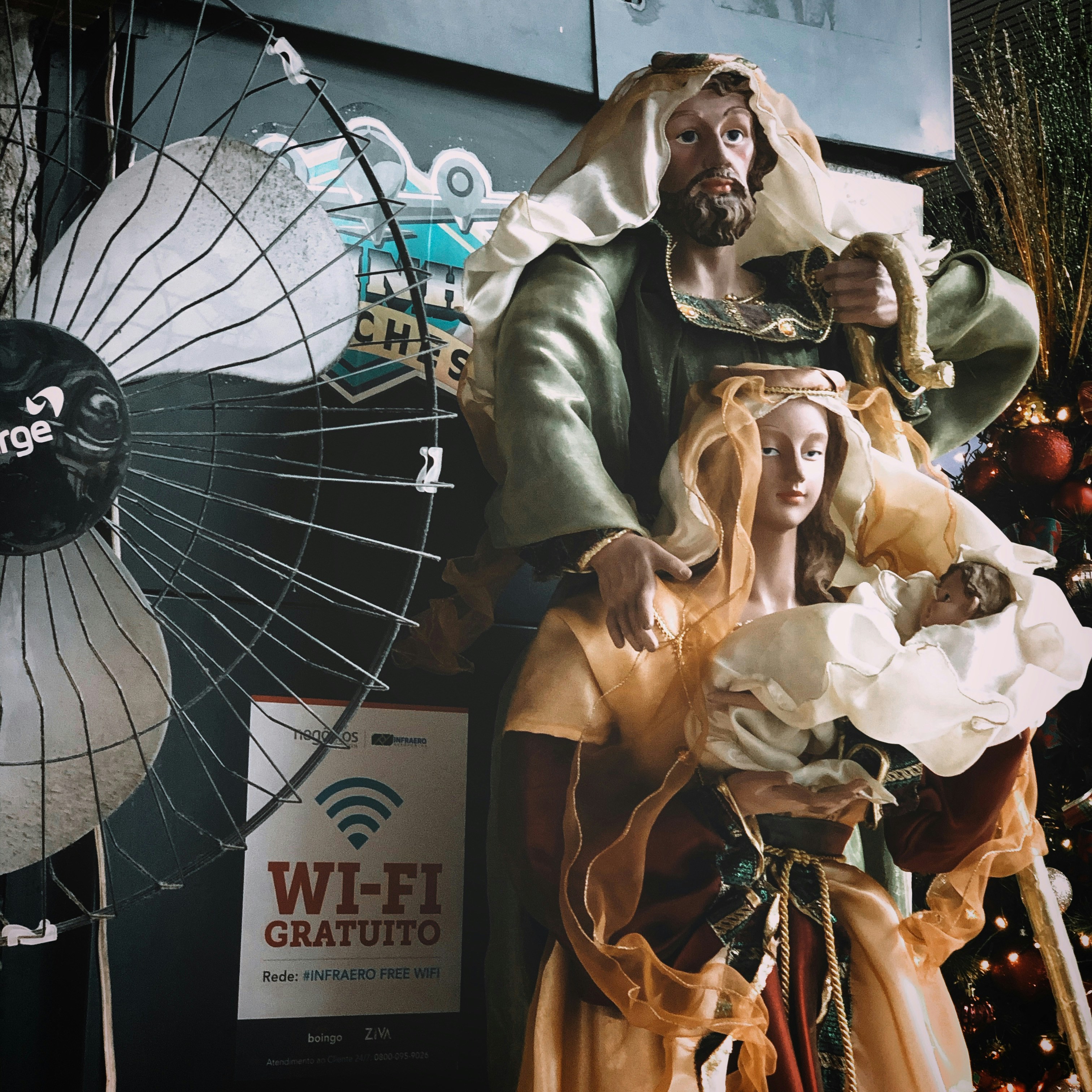 religious statues near electric fan
