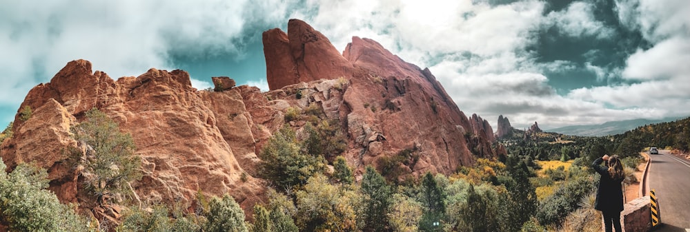 woman standing in front of mountain