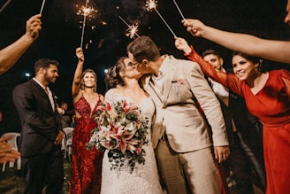 man and woman kissing during nighttime