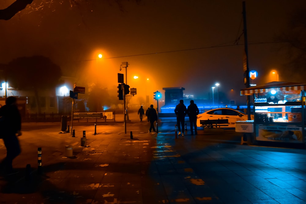 silhouette photo of people walking on street