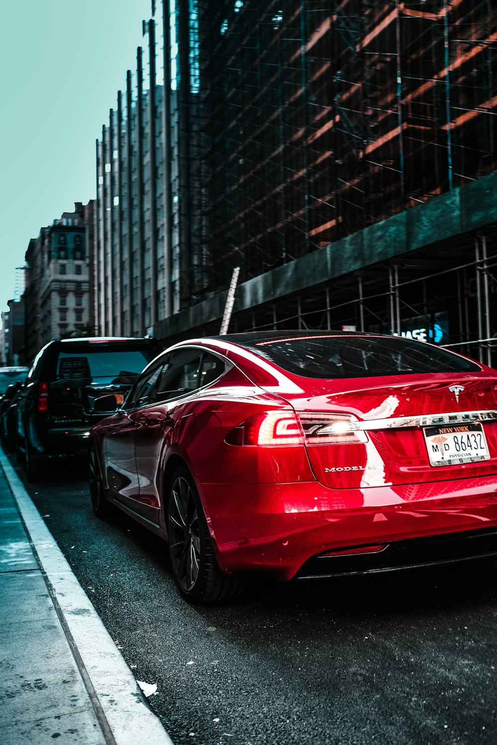 red car parked on street