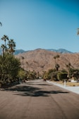 A freshly pressure-washed driveway shining clean, highlighting the contrast with the surrounding desert landscape.