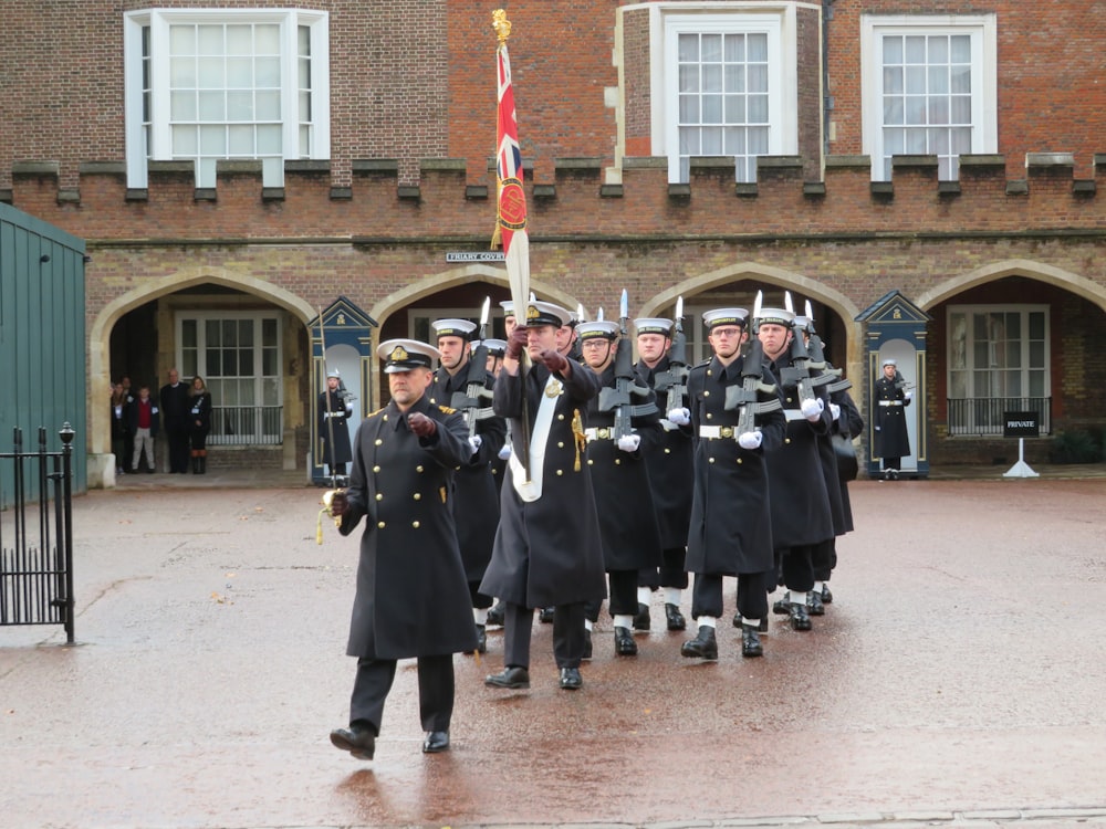 parade of soldiers during daytime