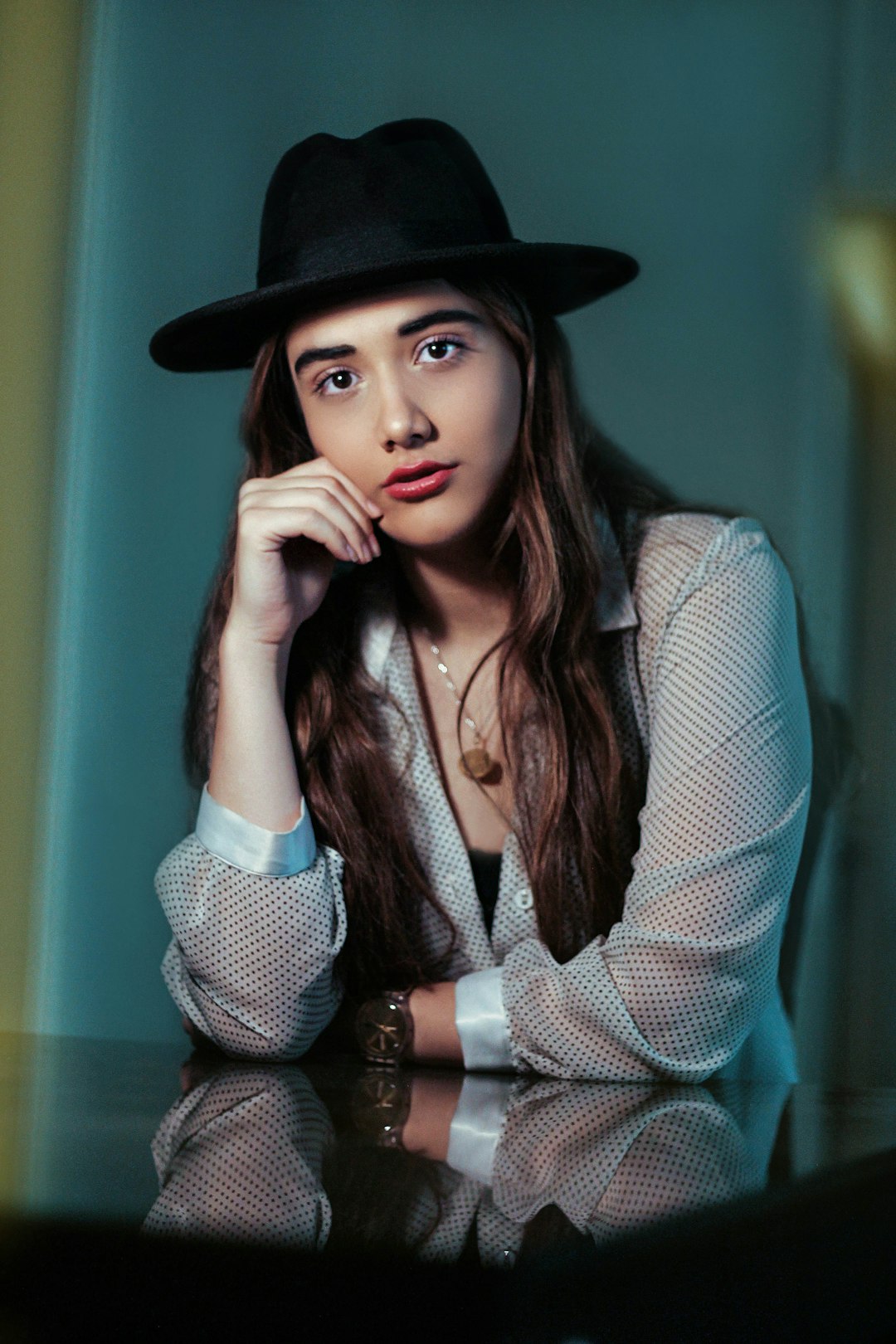 woman sitting beside table