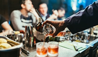 man pouring drink