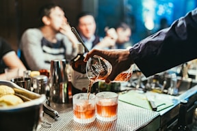 man pouring drink