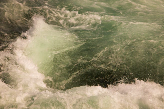 A vibrant splash of lemon green waves blending into deep blue currents, evoking energy and calm.