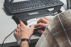 person holding black plastic case