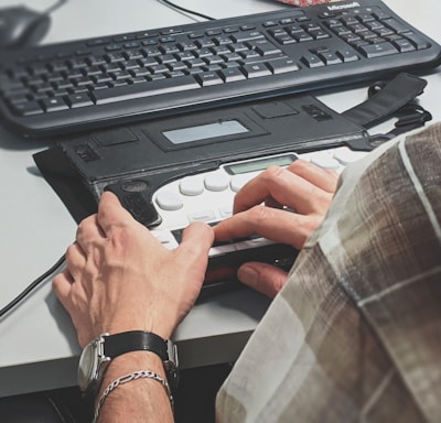 person holding black plastic case