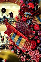 Colorful event hall decorated with bug-themed party decorations and happy children