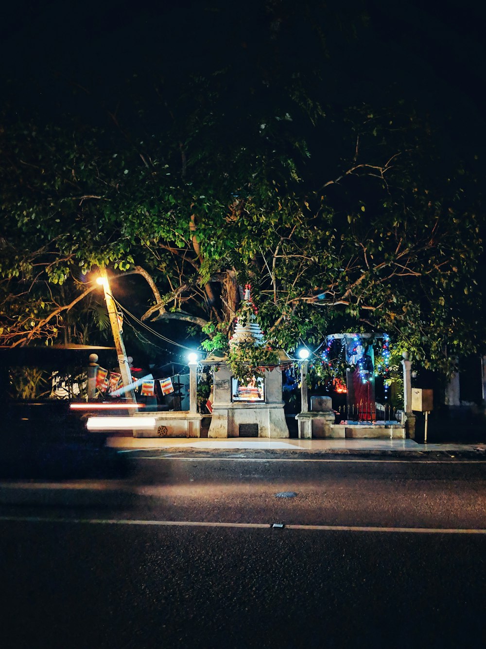 photo of gray statue and green trees