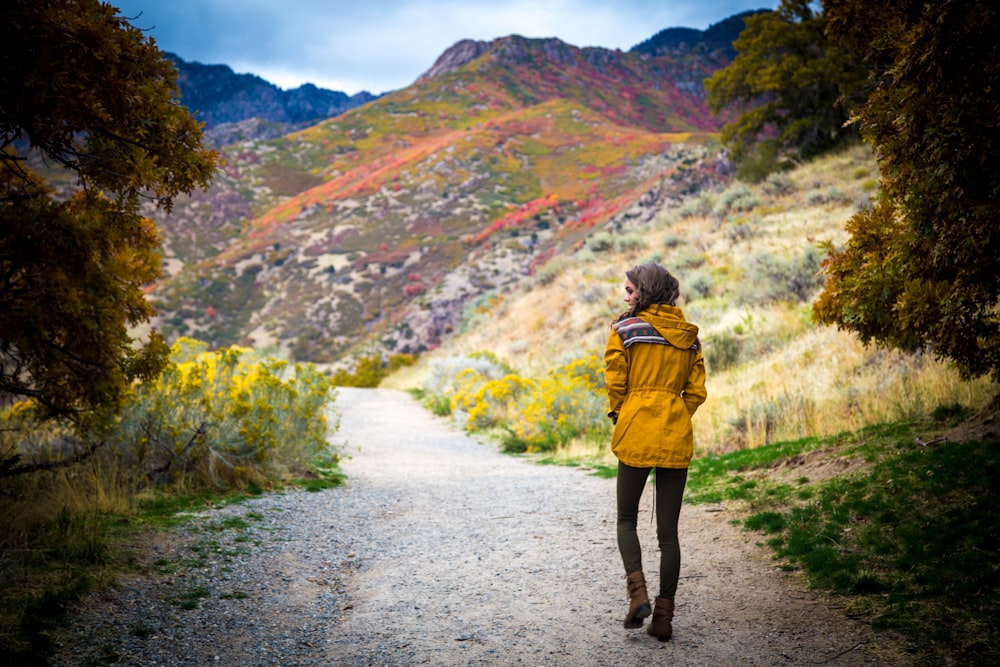 woman walking near hills