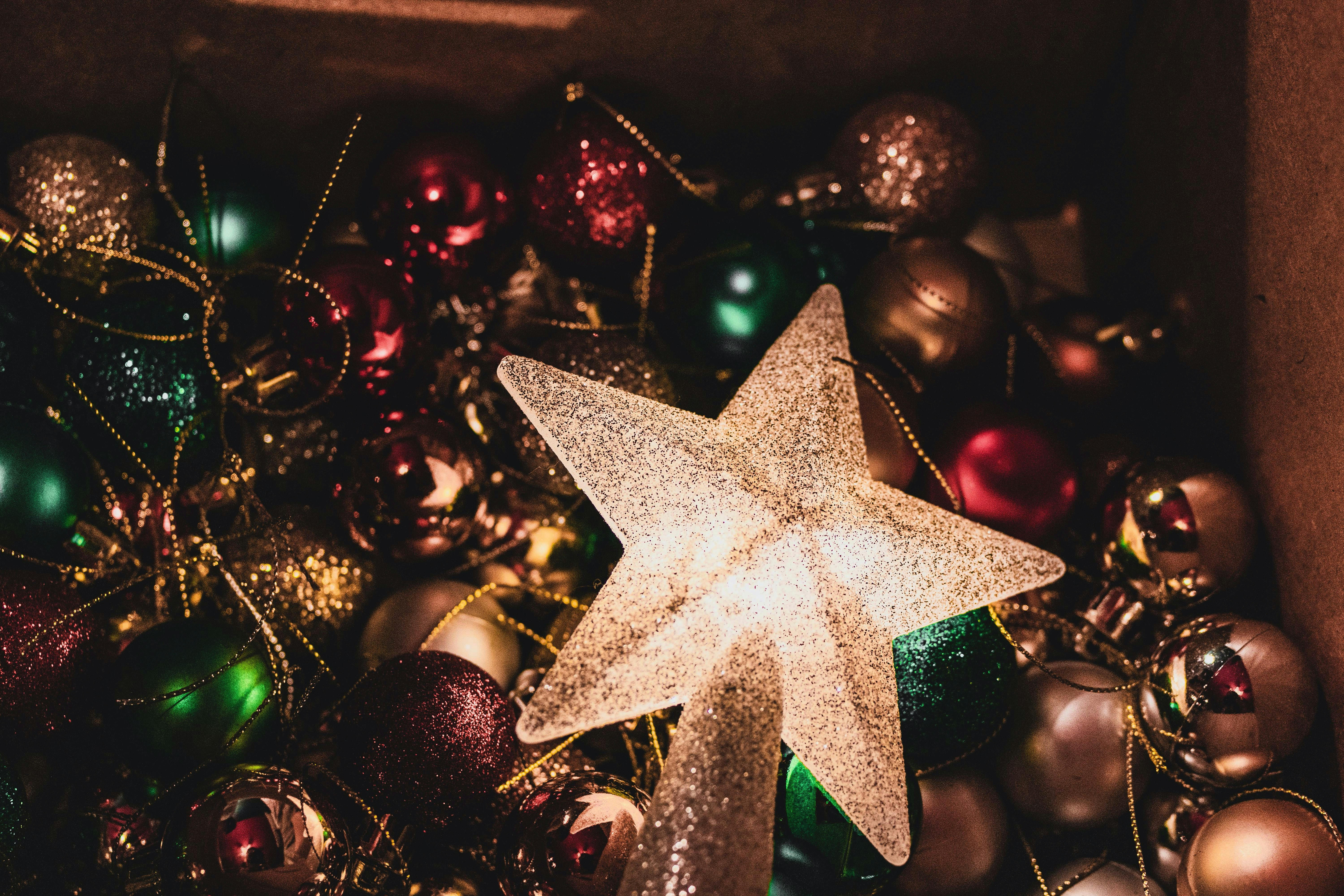 gold star beside Christmas bauble ball collection