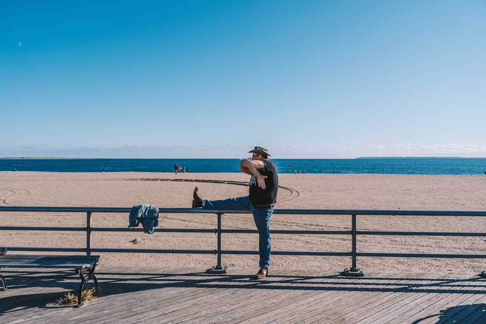 man leaning on railing