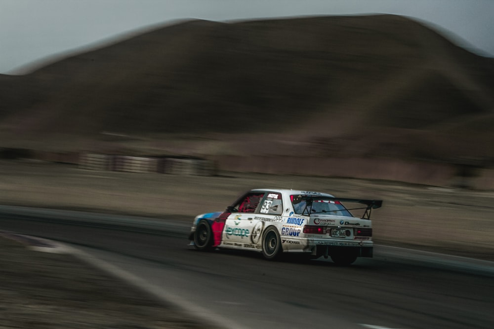 white, red, and blue race car