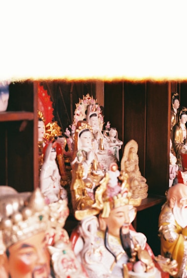 A vibrant display of collectible figurines arranged on wooden shelves with warm lighting.