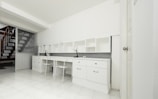 two chairs beside white wooden desk