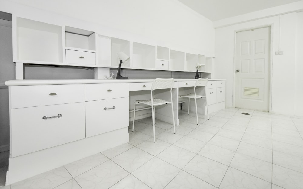 white wooden kitchen cupboards