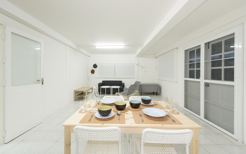 four black ceramic bowls on table inside house