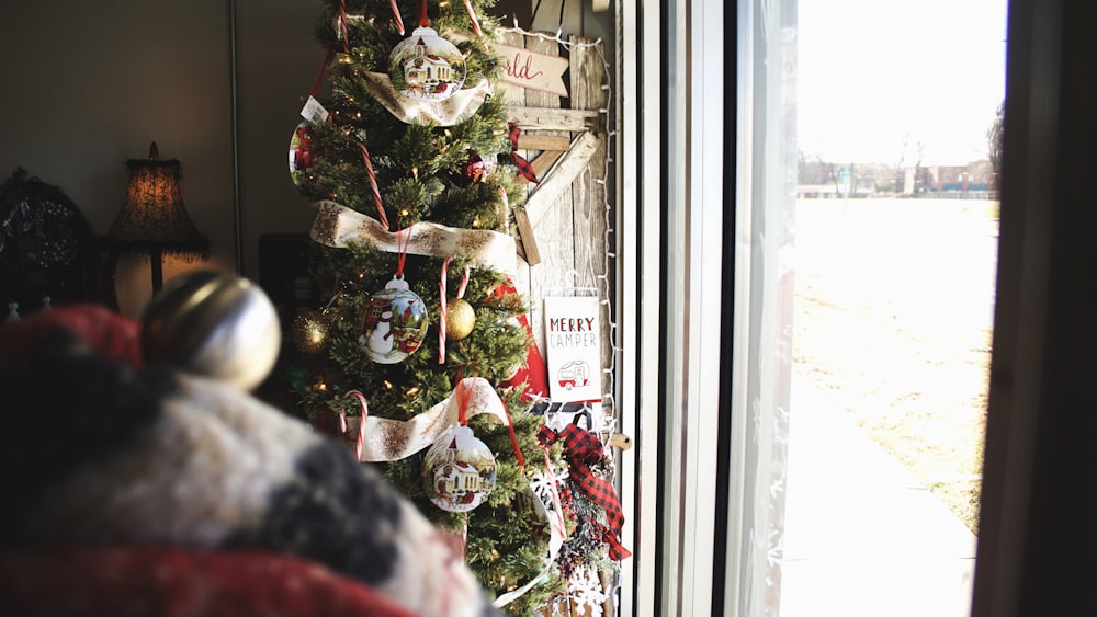 green Christmas tree with ornaments