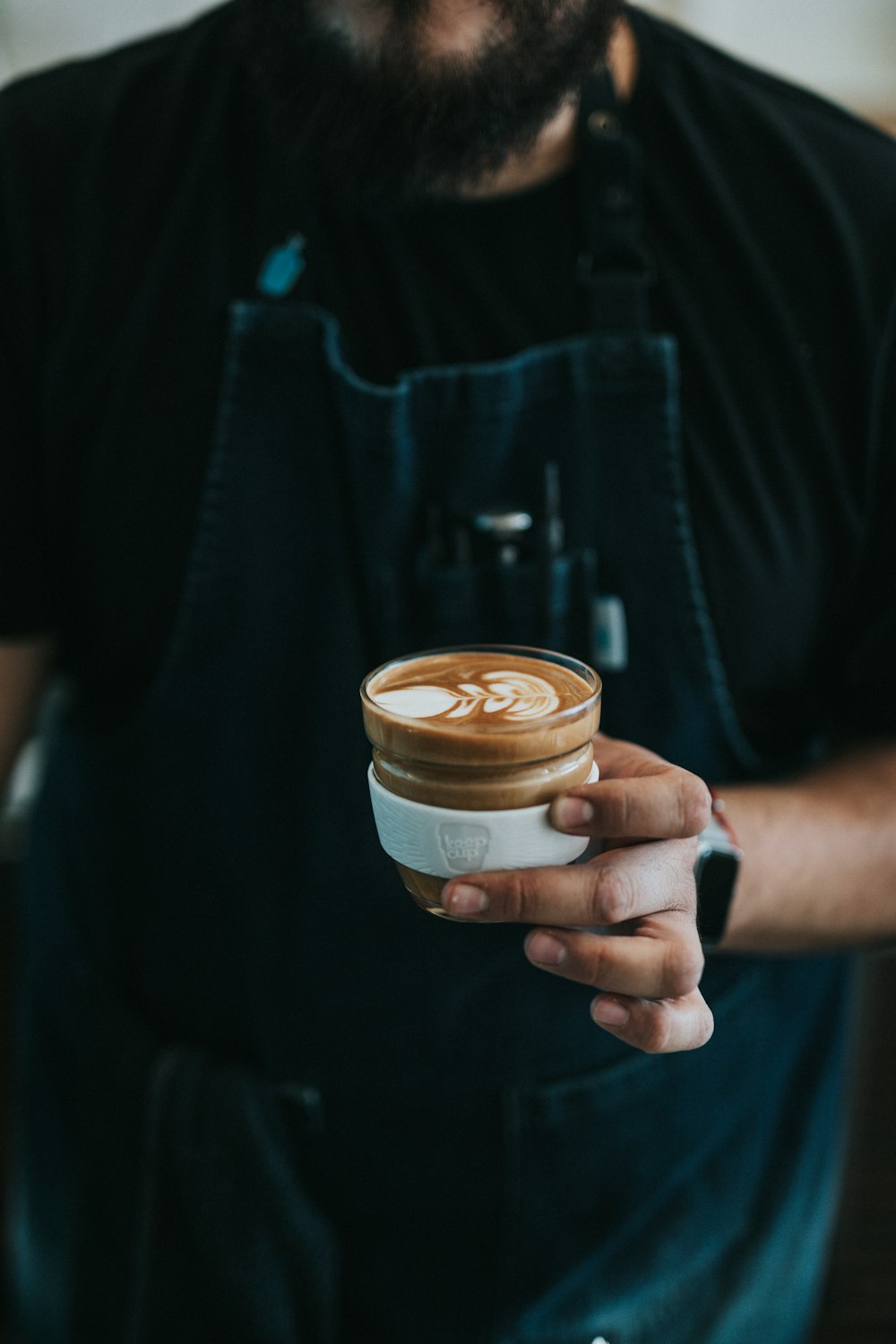 person holding mug of coffee