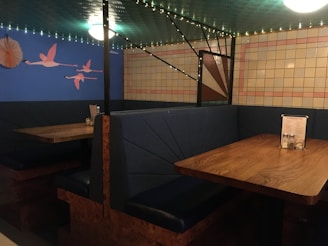 A cozy dining setup with blue and sand-colored decor.