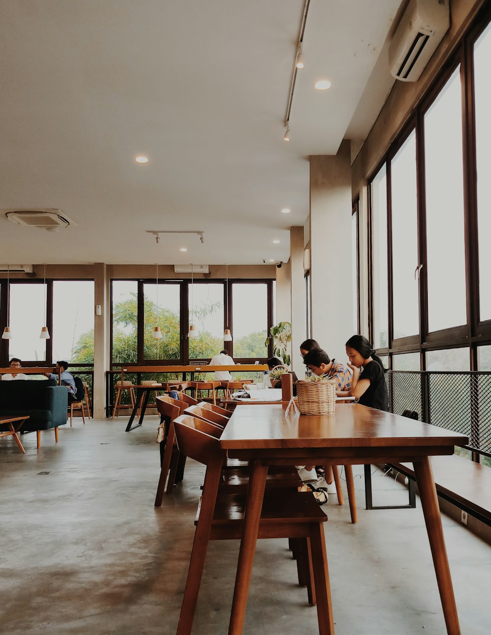 people sitting in front of brown wooden table