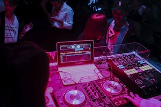 white laptop and audio system