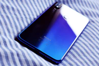 Back view of a phone showcasing its textured surface and elegant color gradient.