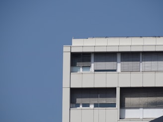 Commercial building exterior with fresh paint and new windows.
