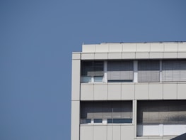 Finished commercial building exterior showcasing clean roofing and modern windows.