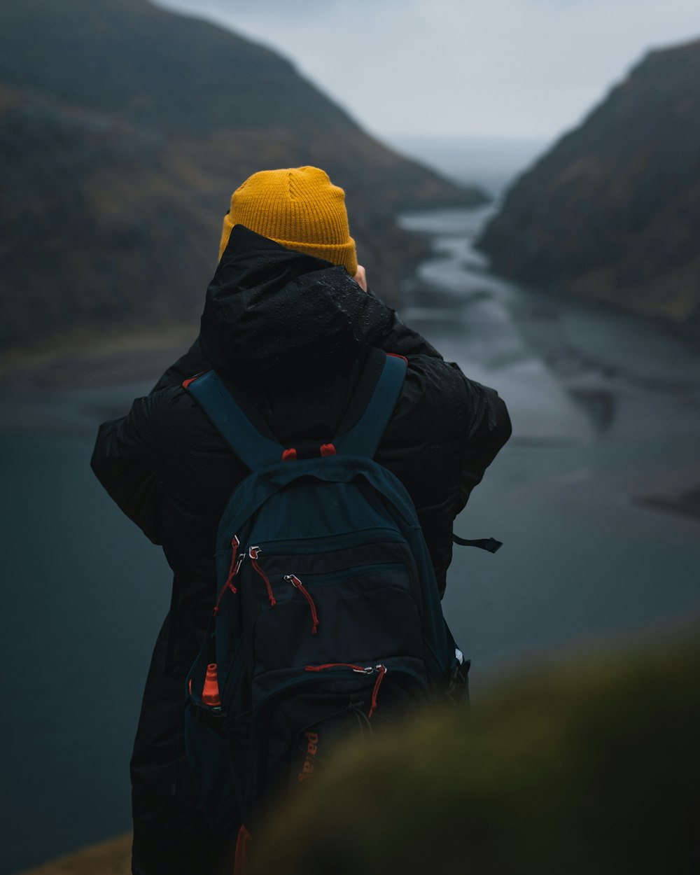 person carrying blue backpack