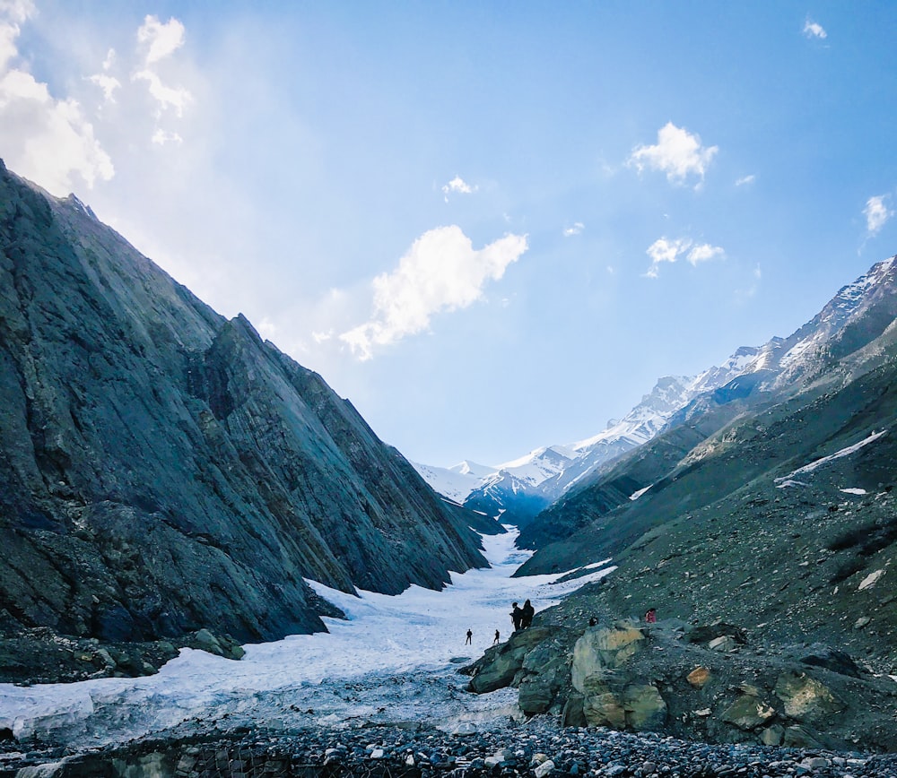 people standing near river