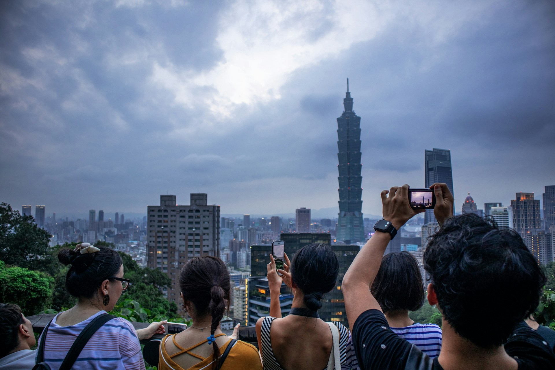 woman wearing yellow long-sleeved dress under white clouds and blue sky during daytime