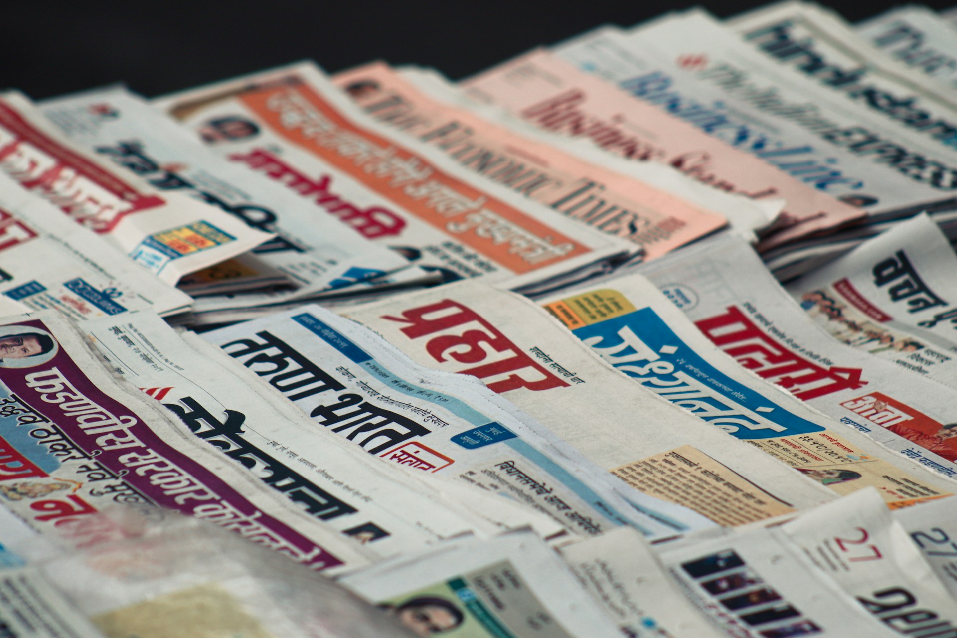 macro photography of assorted newspaper