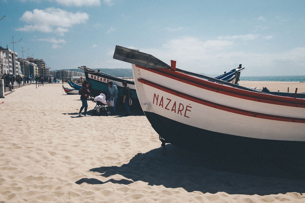 boats on white sand beach