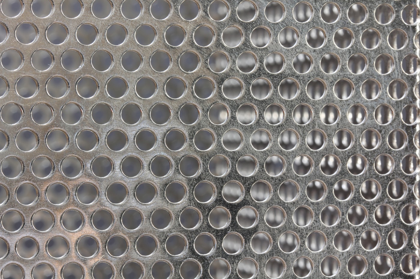 Close-up of a perforated metal grille panel