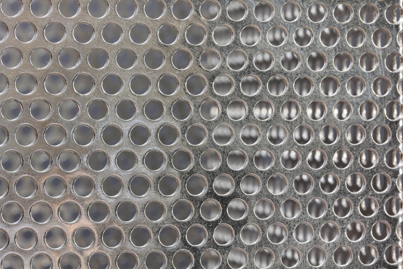 Close-up of a perforated metal grille panel