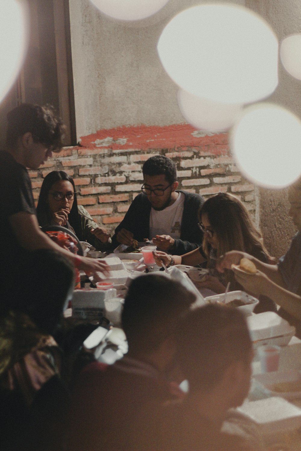 men and women gathered around a table