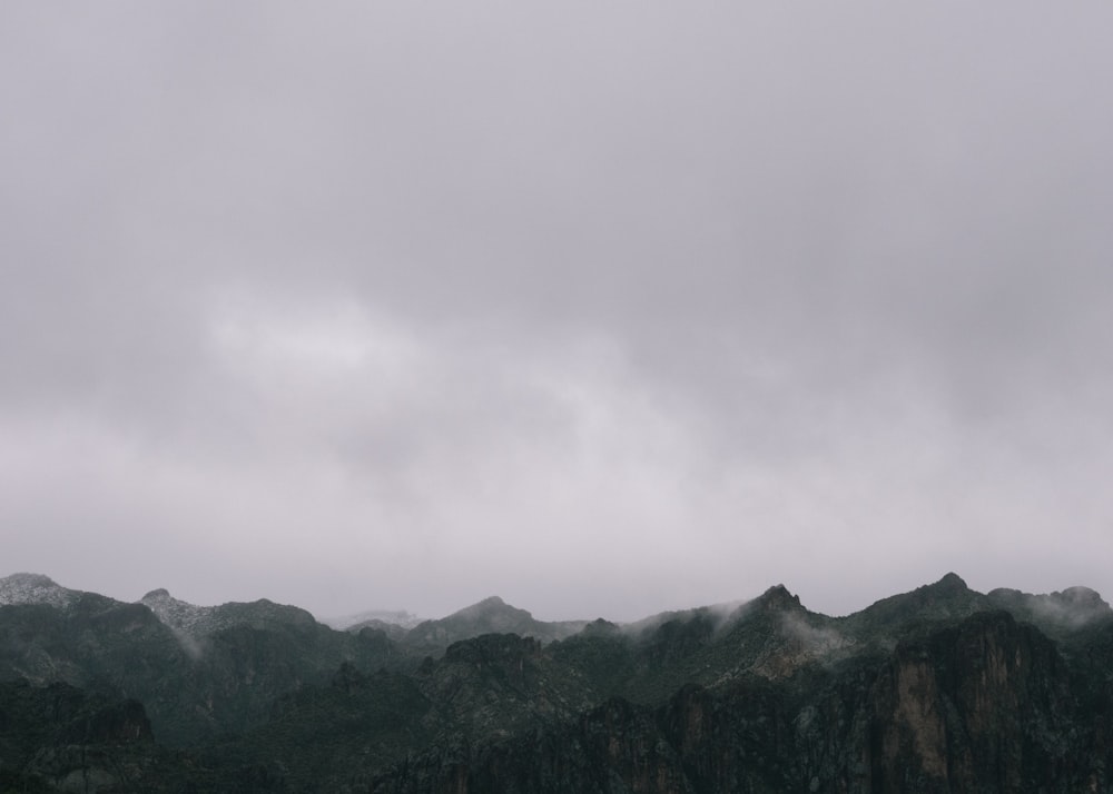mountains under gray sky