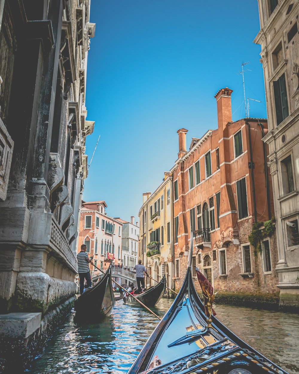 gondola boats in a canal in Venice, Italy